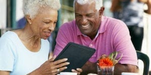 senior couple on ipad