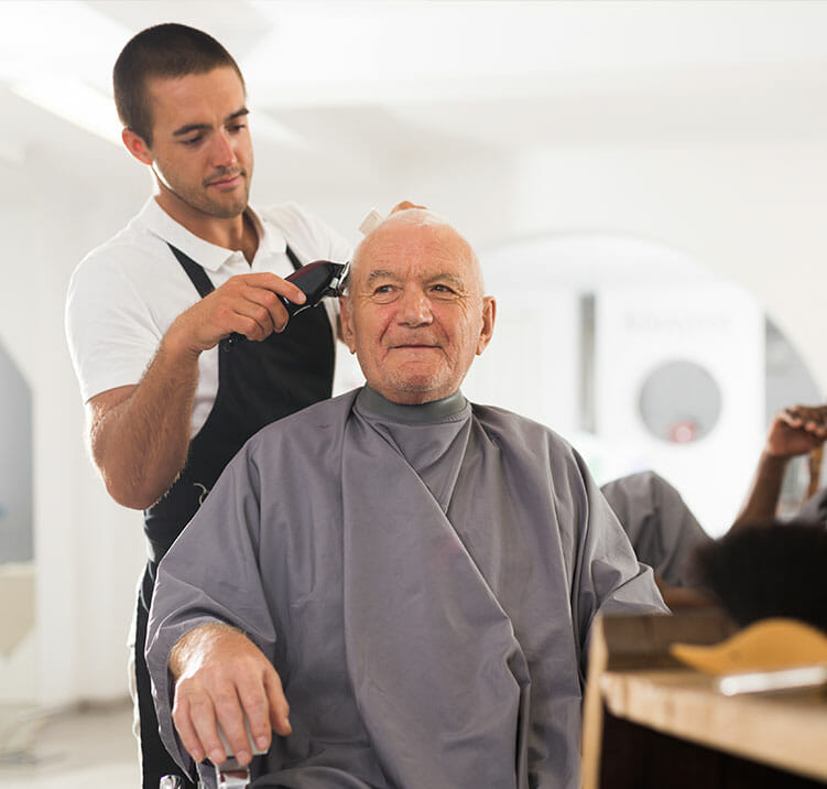 senior man getting a haircut