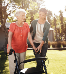 senior woman walking with a walker