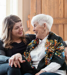 staff member sitting with senior