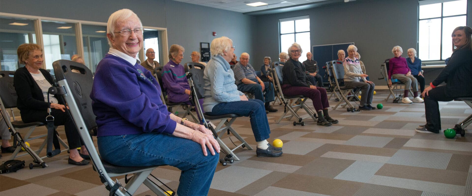 Seniors sitting in activity room